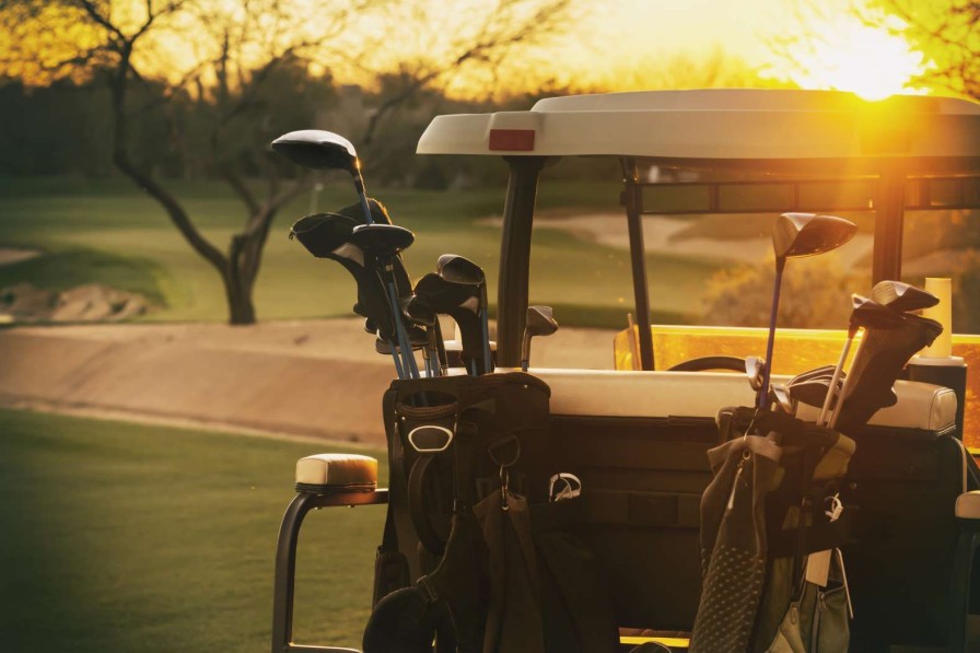 Sport Wallgroup | Golfwagen Bij Zonsondergang Fotobehang