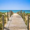 Landschap Wallgroup | Houten Brug Naar Het Strand Fotobehang