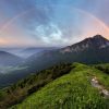 Landschap Wallgroup | Regenboog Boven Een Berglandschap Fotobehang