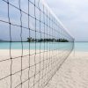 Landschap Wallgroup | Volleybalnet Op Een Tropisch Strand Fotobehang