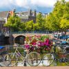 Architectuur Wallgroup | Fietsen Op Een Amsterdamse Brug Fotobehang